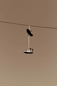 Stylish Nike Shoes Hanging in Los Angeles Skyline