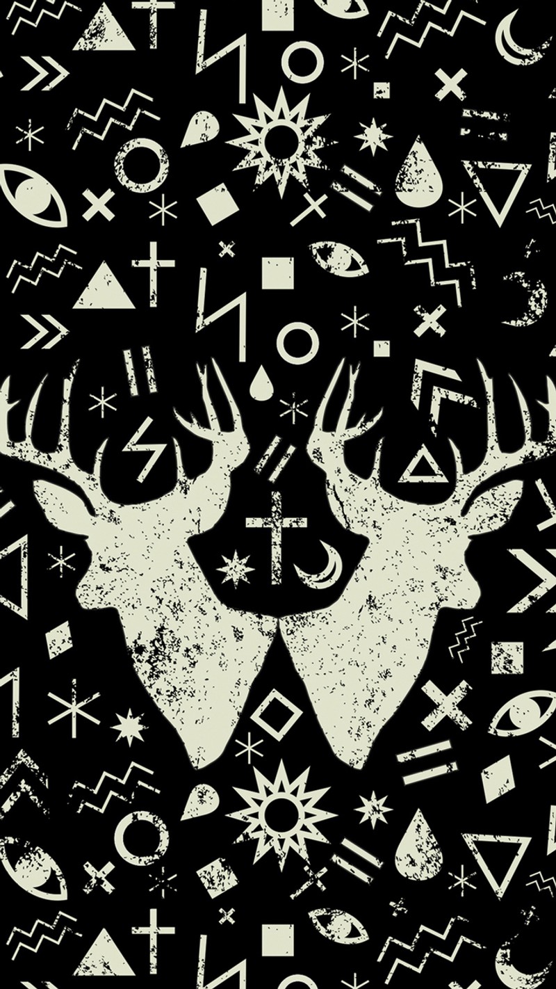 A close up of a black and white pattern with deer heads (pattern, punk)