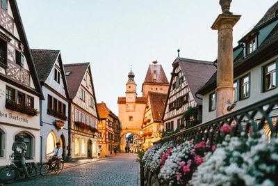 Charming medieval architecture along a cobblestone street in a picturesque German town at dusk.