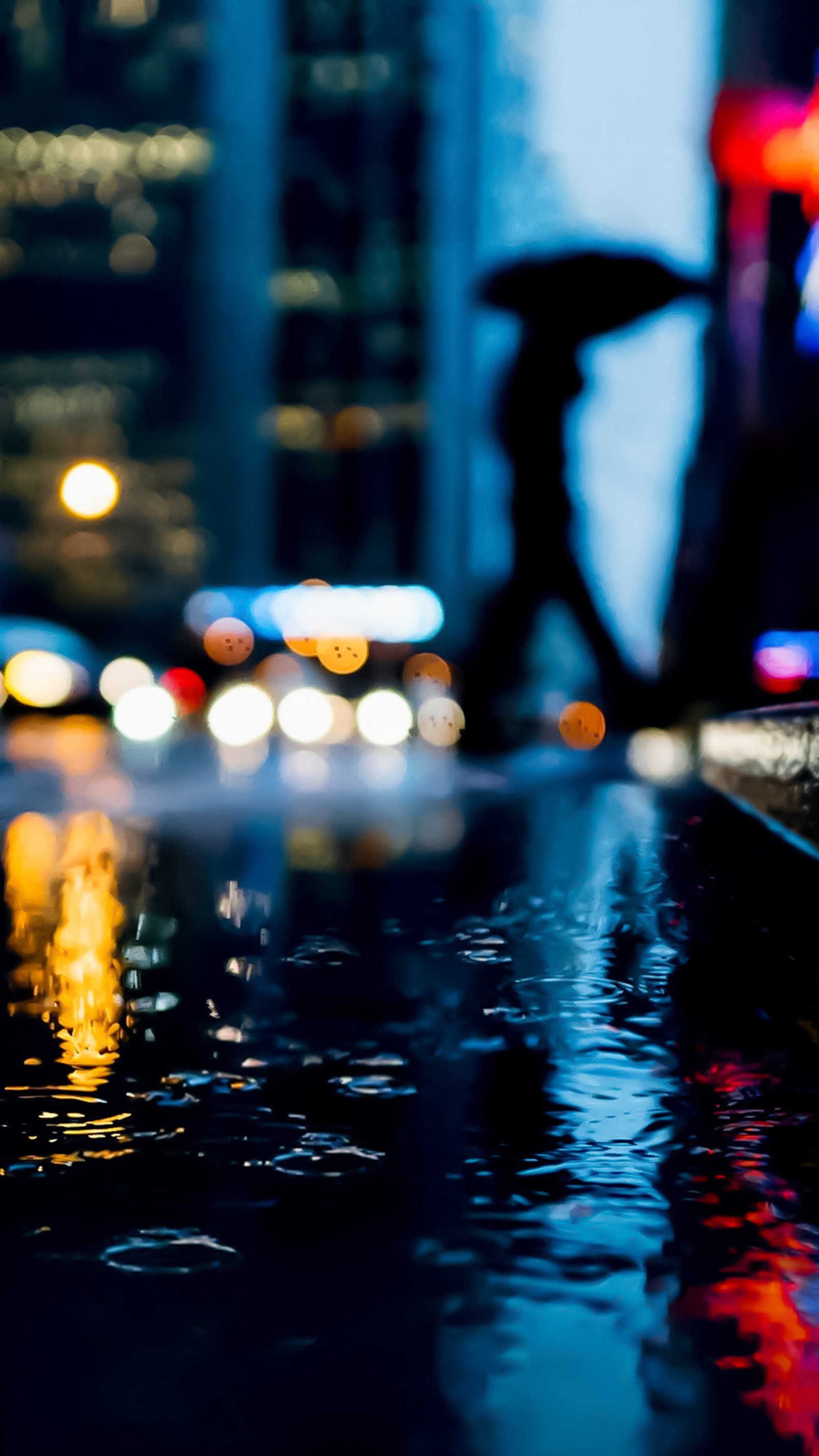 There is a blurry image of a city street at night (bokeh, pixel)