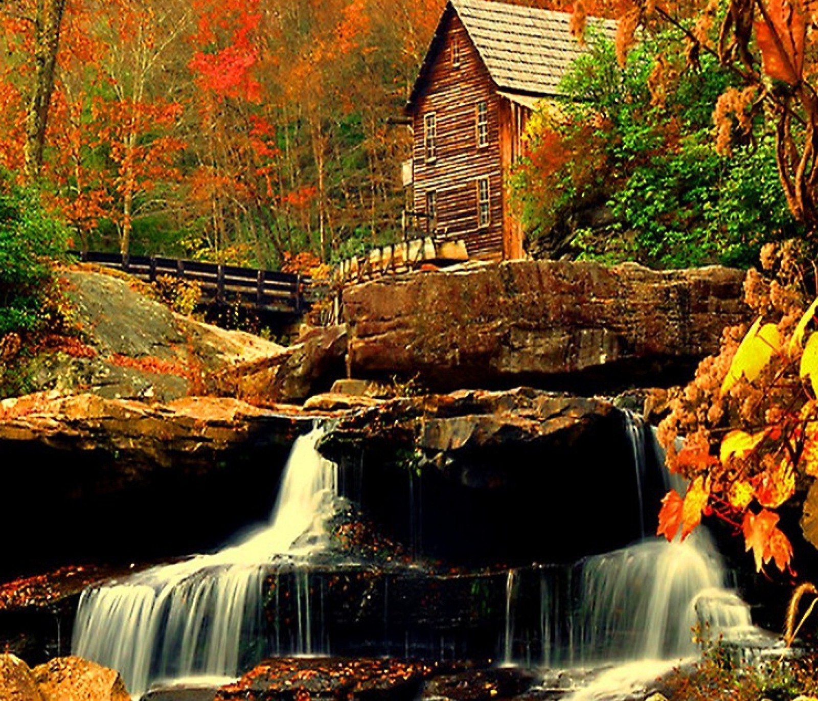 Waterfall in front of a wooden cabin in the woods (autumn, falls, house, landscape, nature)