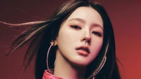 Miyeon from (G)I-DLE in a striking teaser for the "I Never Die" album, showcasing a chill, tomboy aesthetic with bold makeup and dynamic lighting.