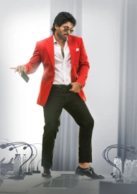 Allu Arjun dans un costume rouge frappant, dégageant charisme et style, parfait pour un fond d'écran HD inspiré par "Ala Vaikunthapurramuloo.