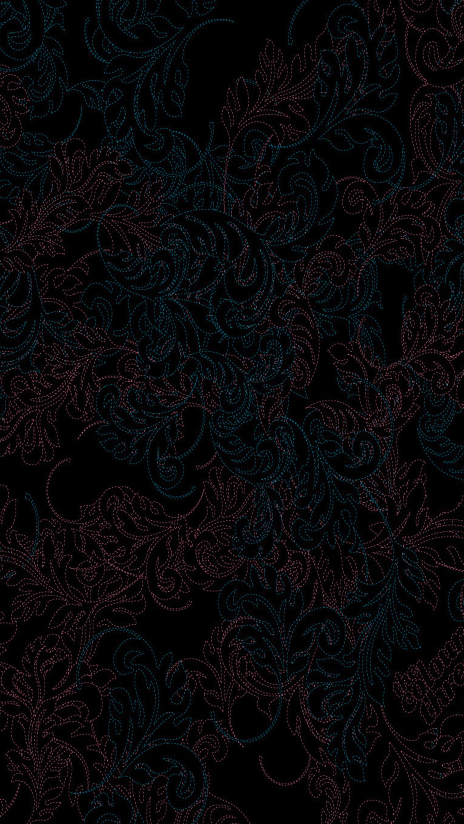 Un gros plan d'un motif floral noir et bleu sur fond noir (motif, mur)