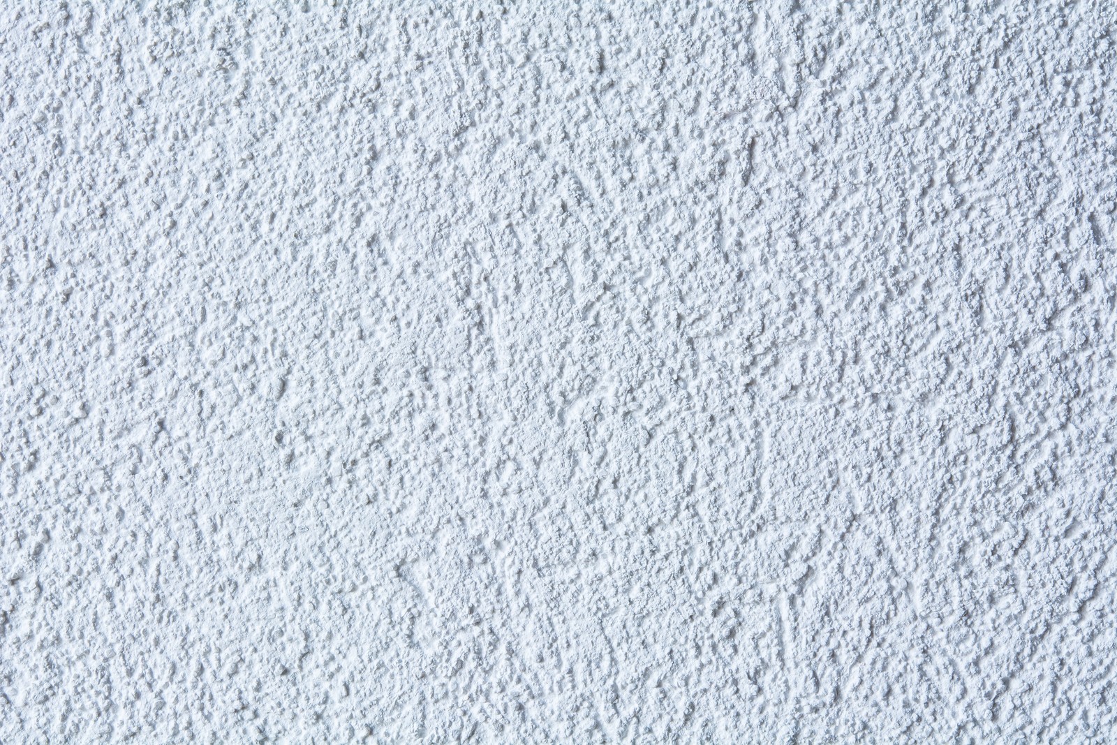 A close up of a white wall with a small amount of snow (wall, texture, floor, white, pattern)