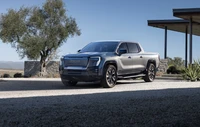 2024 GMC Sierra Издание 1: Современный электрический грузовик в современном ландшафте