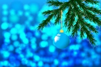 Blue Christmas Ornament Hanging from a Fir Tree Branch