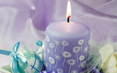 Purple Candle Surrounded by Easter Decorations