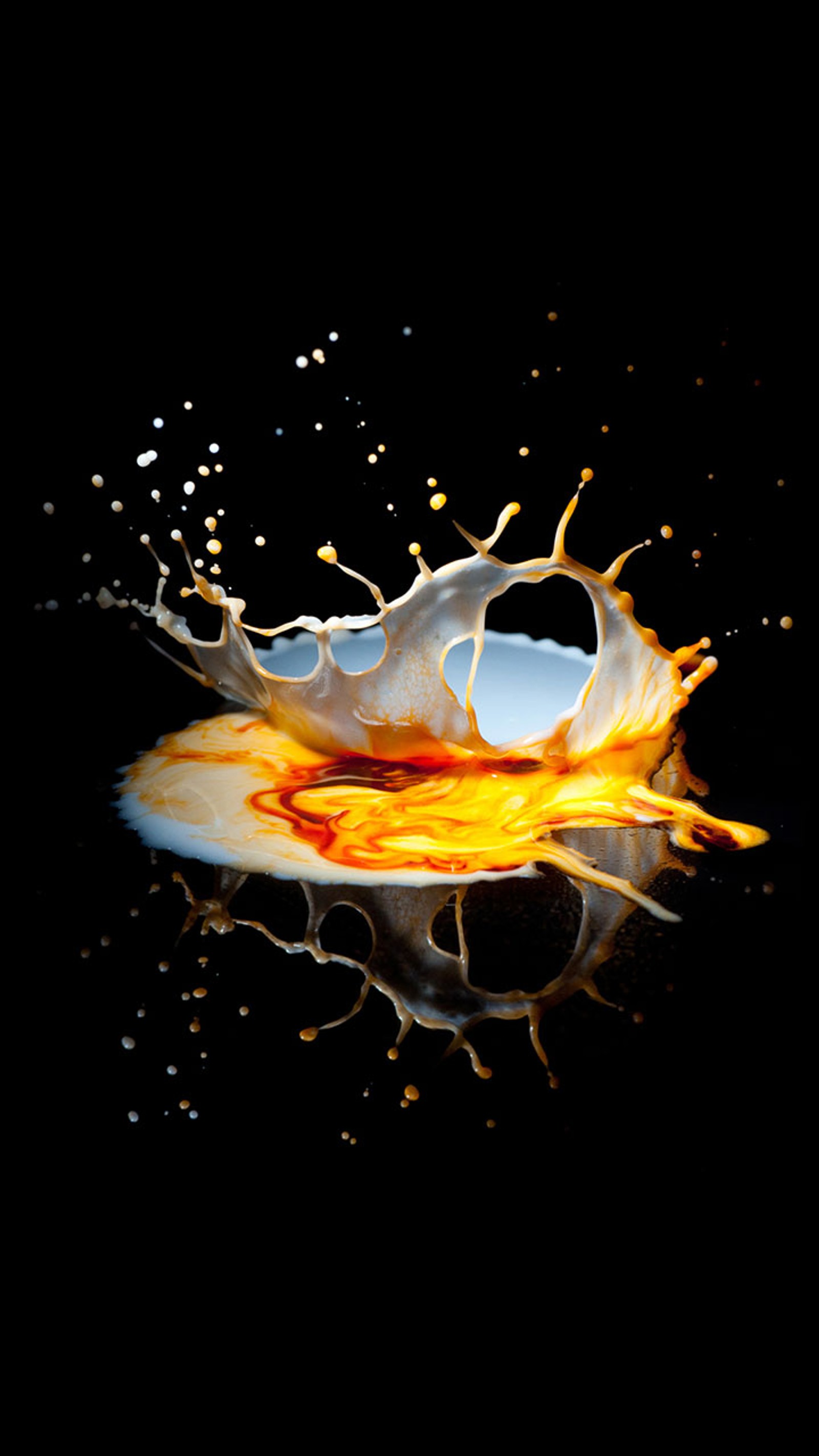 A close up of a liquid splash on a black surface (android, black, colors, iphone, new)