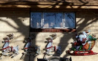 Festive Reindeer and Sled Display with Christmas Lights