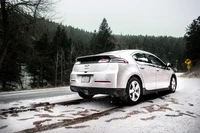 Chevrolet Electric Sedan on Snowy Road