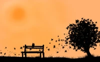 Couple en silhouette sur un banc sous un arbre au lever du soleil