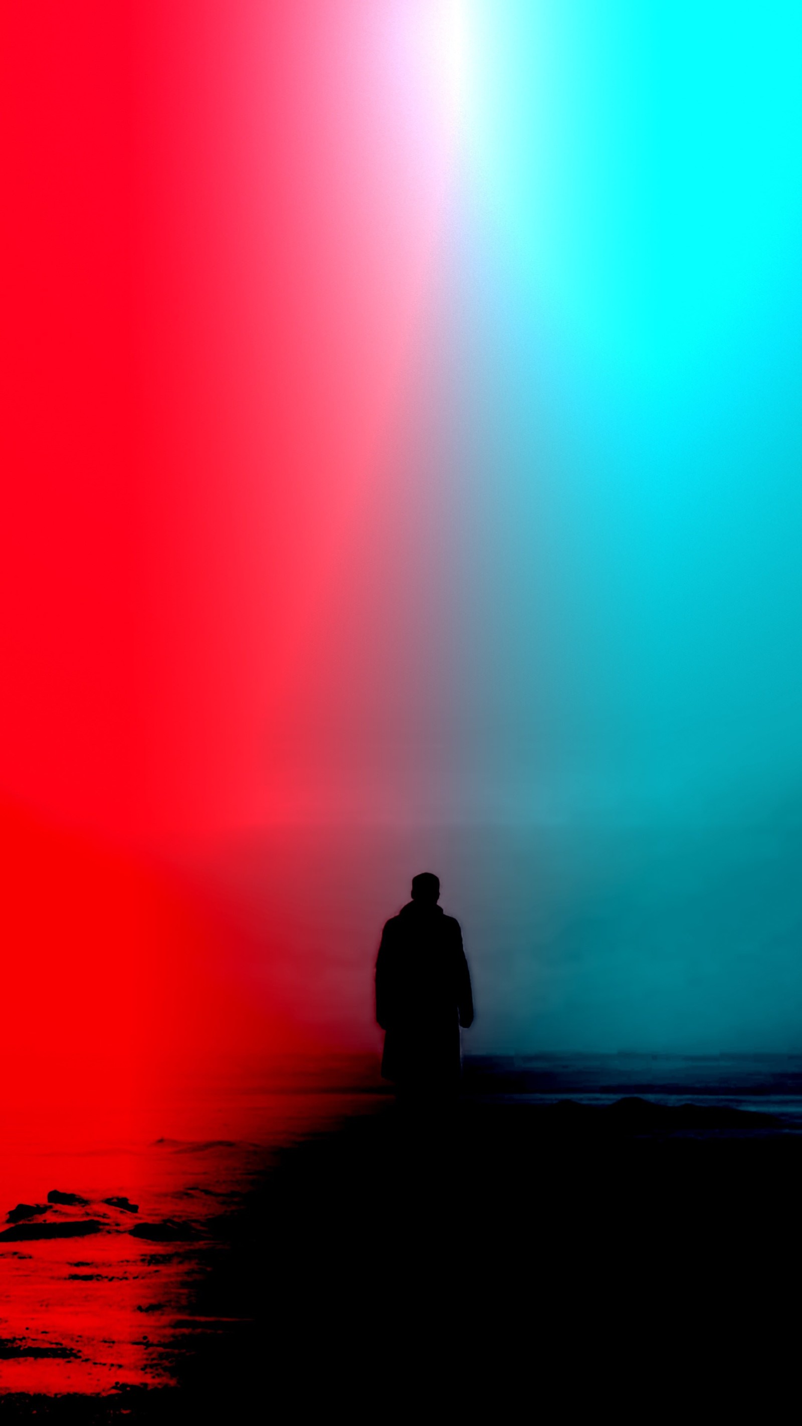 There is a man standing on a beach with a red and blue background (4k, wallpaper just4k)