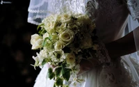 Elegant Bride Holding a White Rose Bouquet Amidst Soft Wedding Gown Details