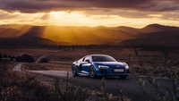 Audi R8 GT 2015 capturado contra un majestuoso paisaje de atardecer