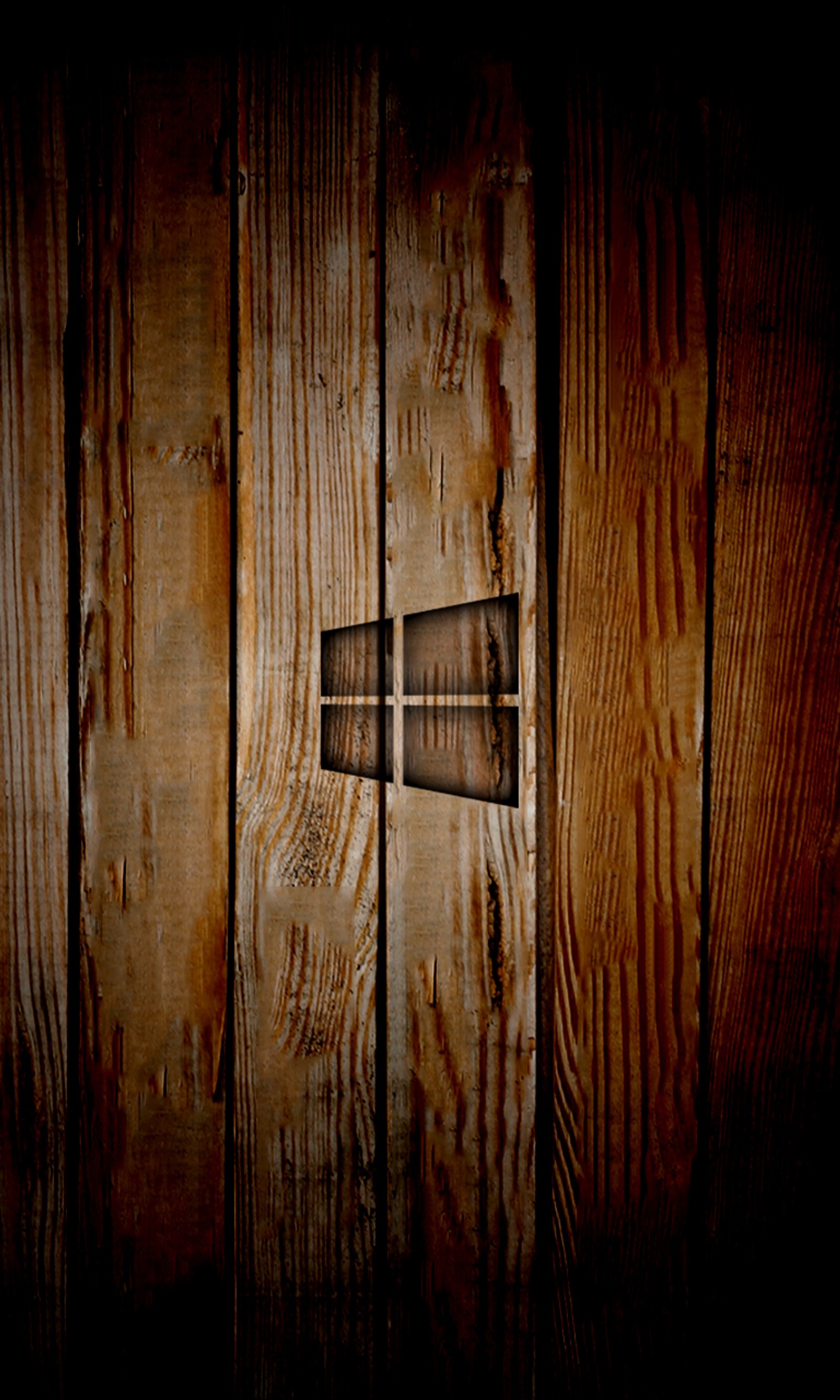 Hay una cruz de madera en la pared de un edificio (quemar, logotipo, textura, ventanas, madera)