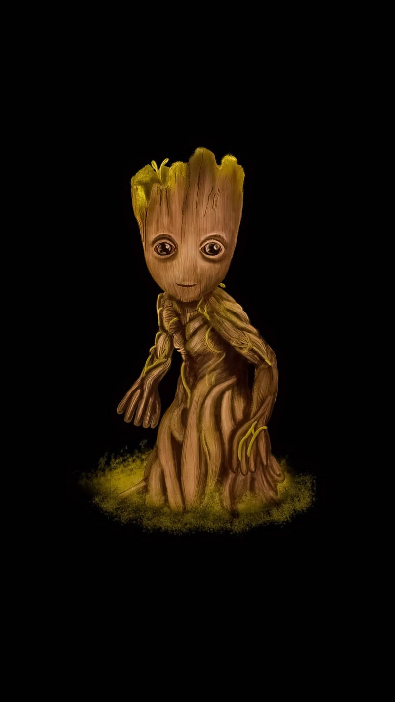 Крупный план маленького существа на черном фоне (дизайны, грут, groot)