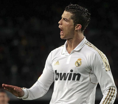 Cristiano Ronaldo in action, passionately directing on the field while wearing his iconic Real Madrid kit.