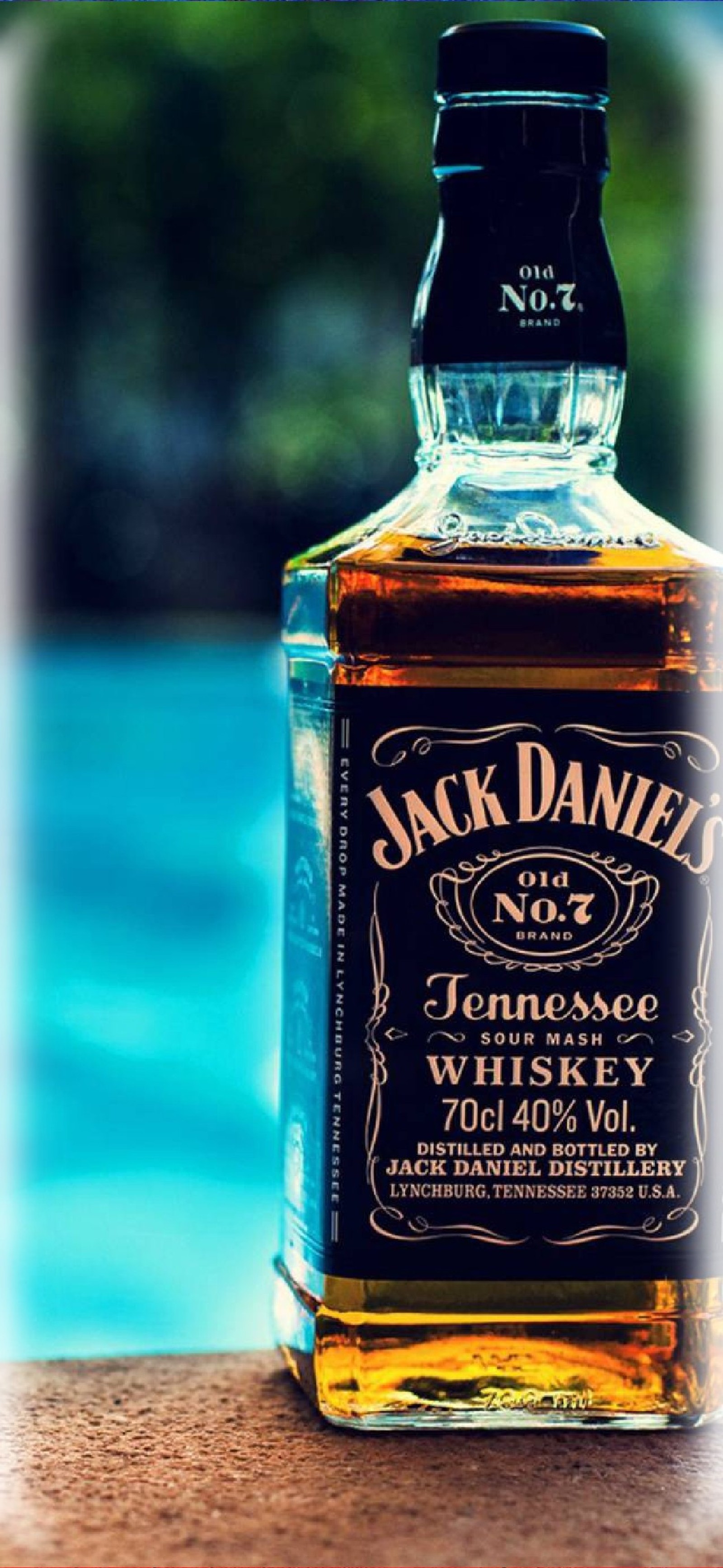 A close up of a bottle of jack daniels whiskey sitting on a ledge (samsung, galaxy, s10, note, 10)