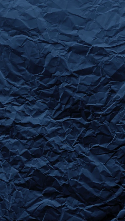 Textura de sábanas arrugadas de color azul oscuro