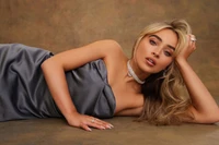 Sabrina Carpenter in a glamorous photoshoot, showcasing elegance and charm.