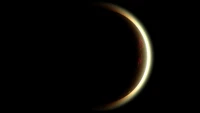 Crescent Moon Illuminated by a Lunar Eclipse Against a Dark Sky