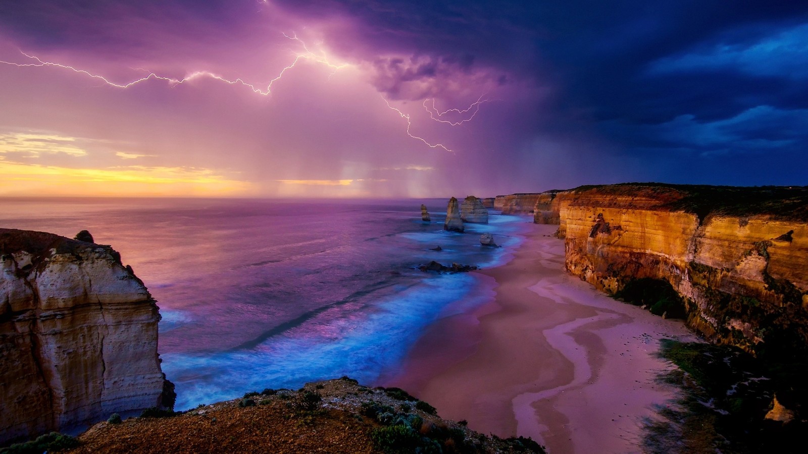 A lightning bolting over the ocean and cliffs at sunset (thunderstorm, sea, cloud, shore, coast)