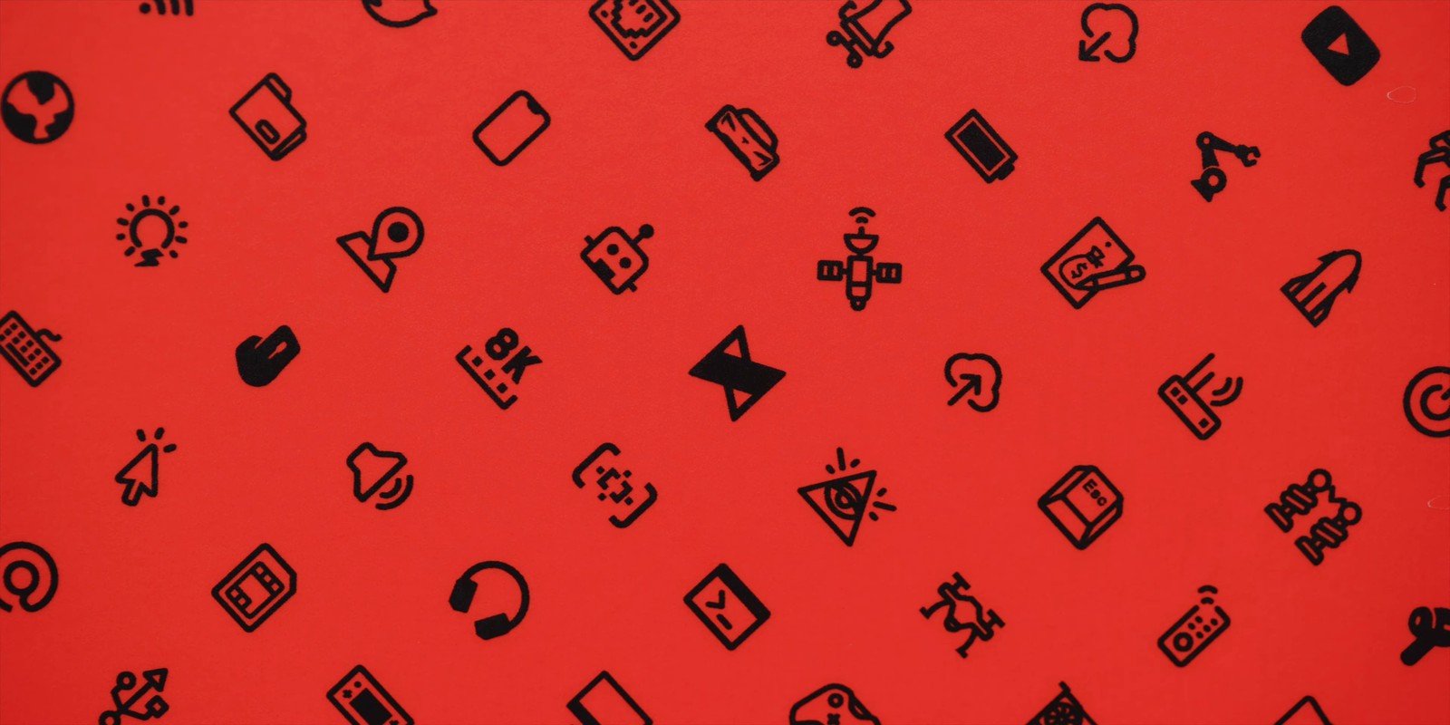 A close up of a red background with black icons (heart, icon, textile, orange, rectangle)