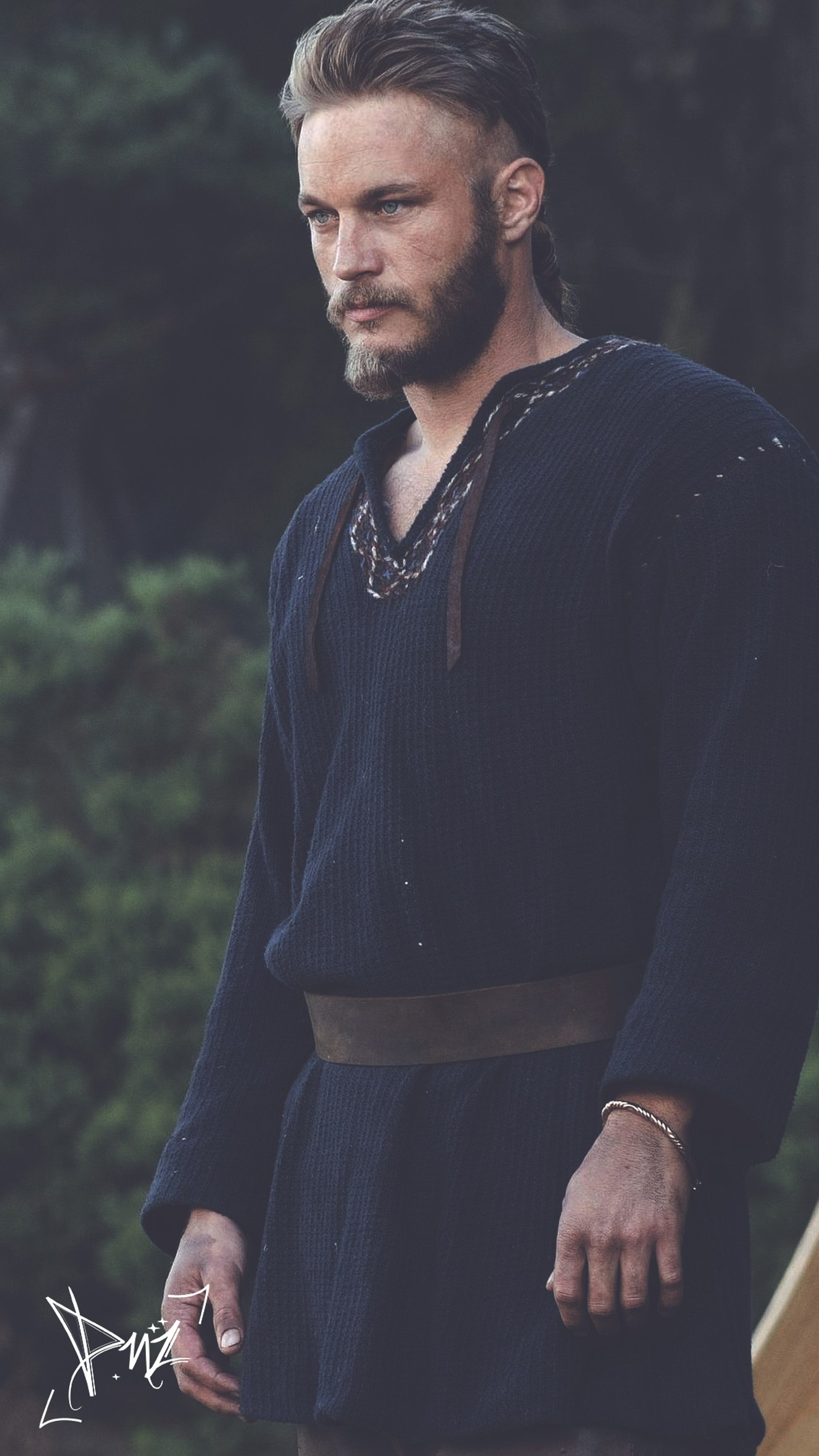 Arafed man in a black outfit standing in front of a wooden structure (gods, ragnar, vikings, warrior)