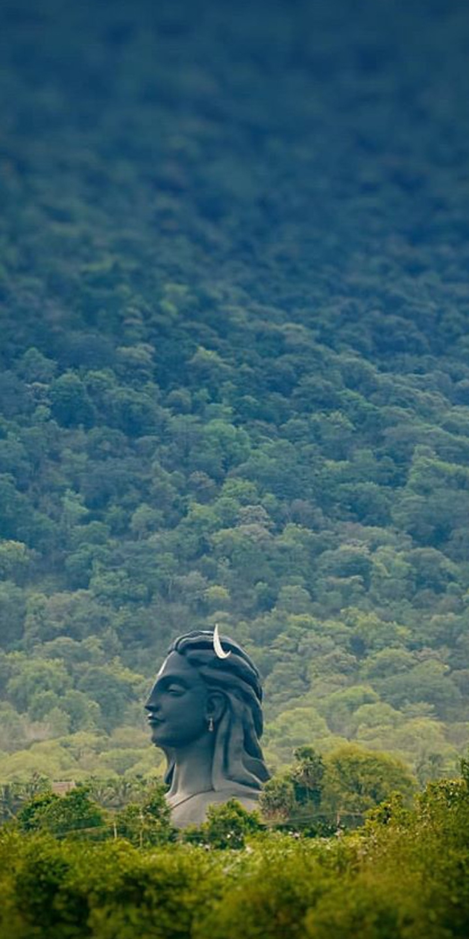 There is a statue of a man with a bird on his head (mountain, ocean, pubg wallpaper, view, wallpaper)