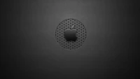 Black and white textured vector graphic featuring a circular pattern with an embossed Apple logo.