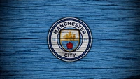 Logo de Manchester City FC sur un fond en bois