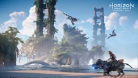 Aloy navigating a lush, post-apocalyptic landscape with towering structures and flying creatures in "Horizon Forbidden West.