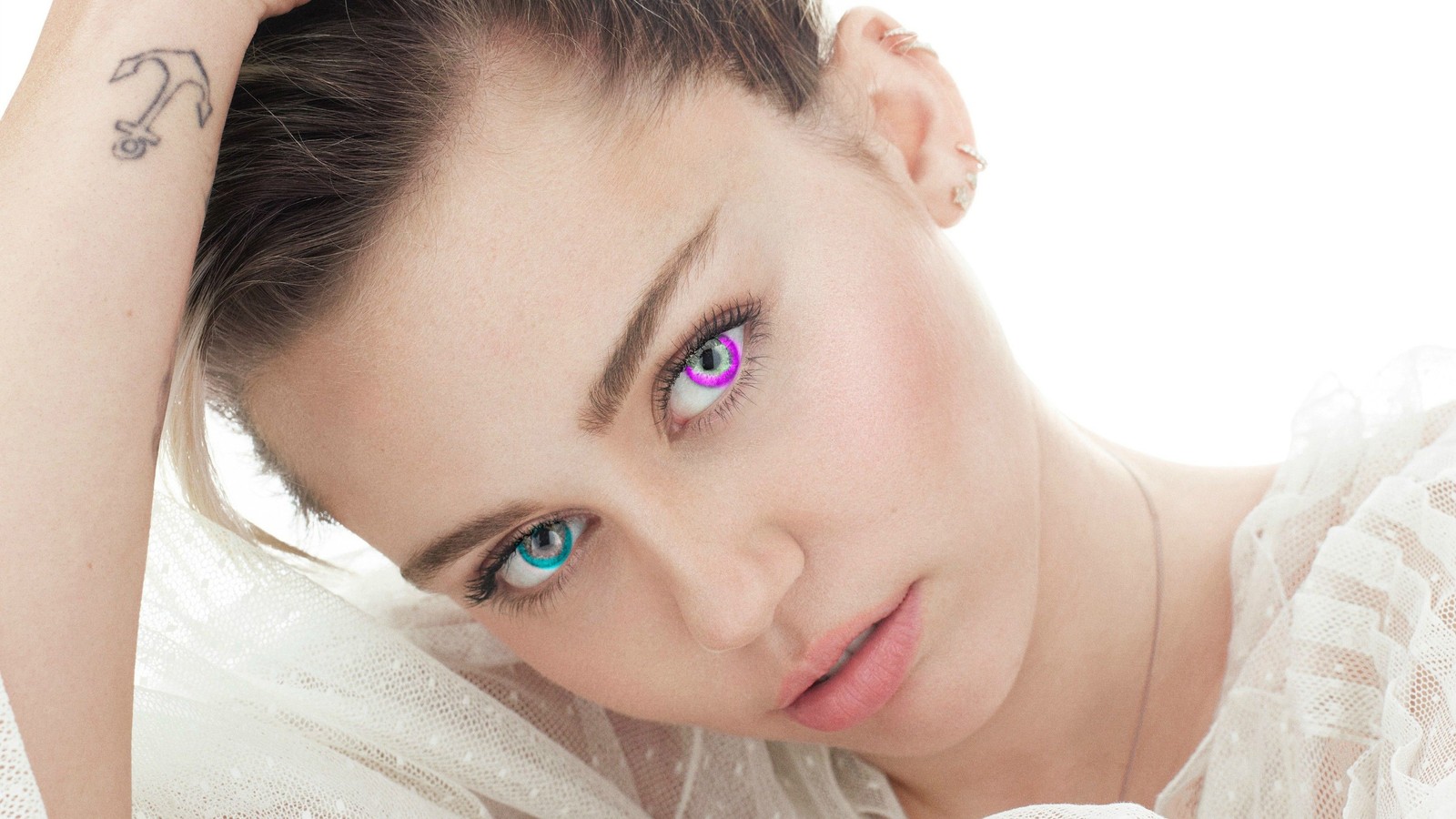 Arafed woman with a tattoo on her arm and a purple eyeliner (miley cyrus, heterochromia, singer, celebrity, women)