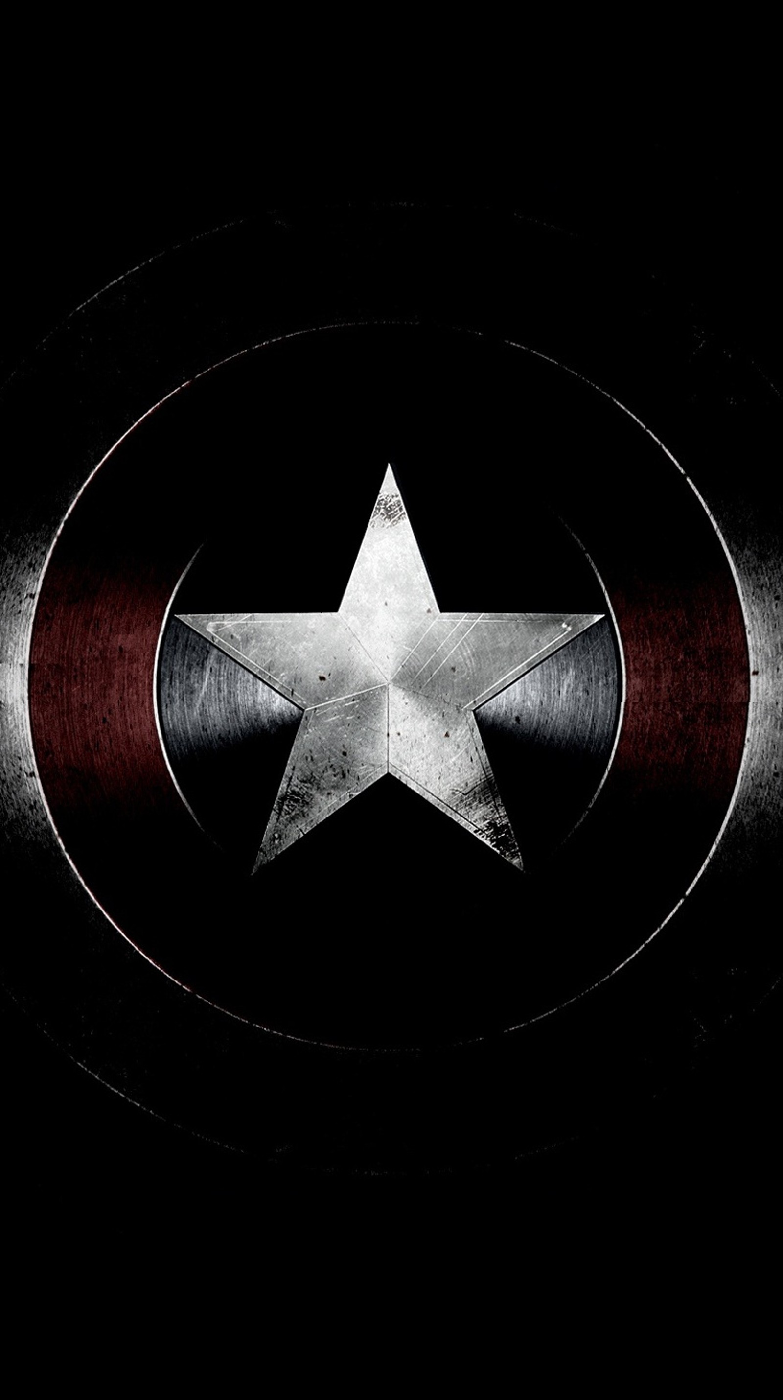 Logo de captain america sur fond noir (avengers, marvel, bouclier)