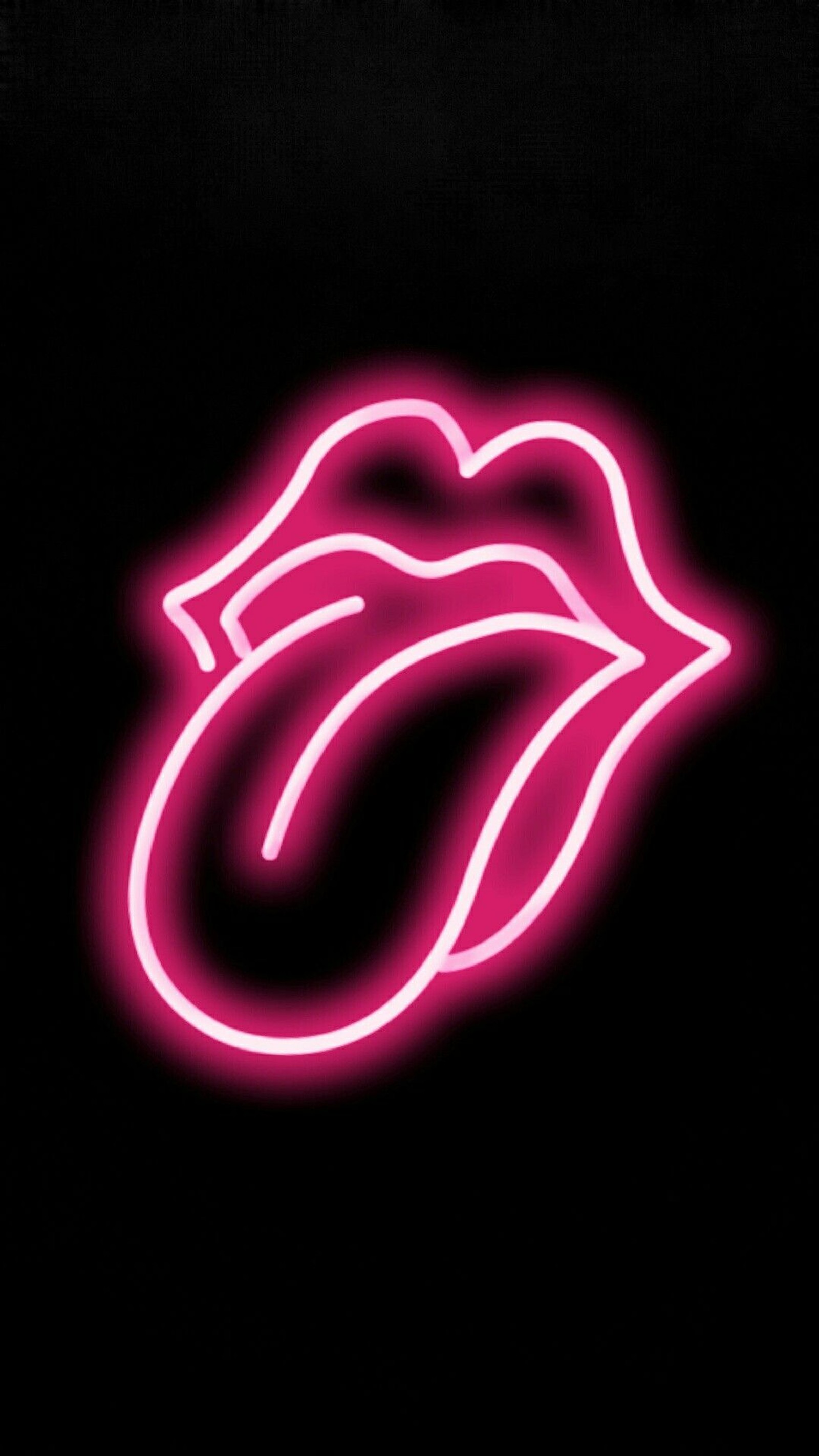 Un gros plan du logo néon des rolling stones sur un fond noir (néon, rose, rolling stones, langue)