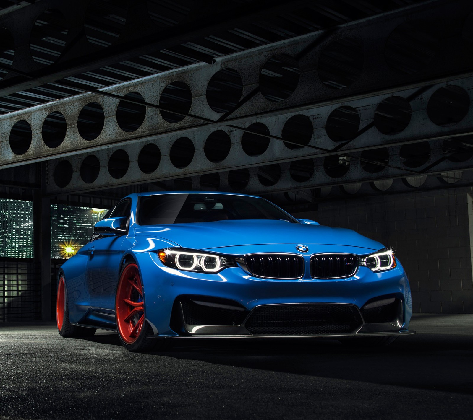 A close up of a blue bmw car parked in a garage (blue, bmw)