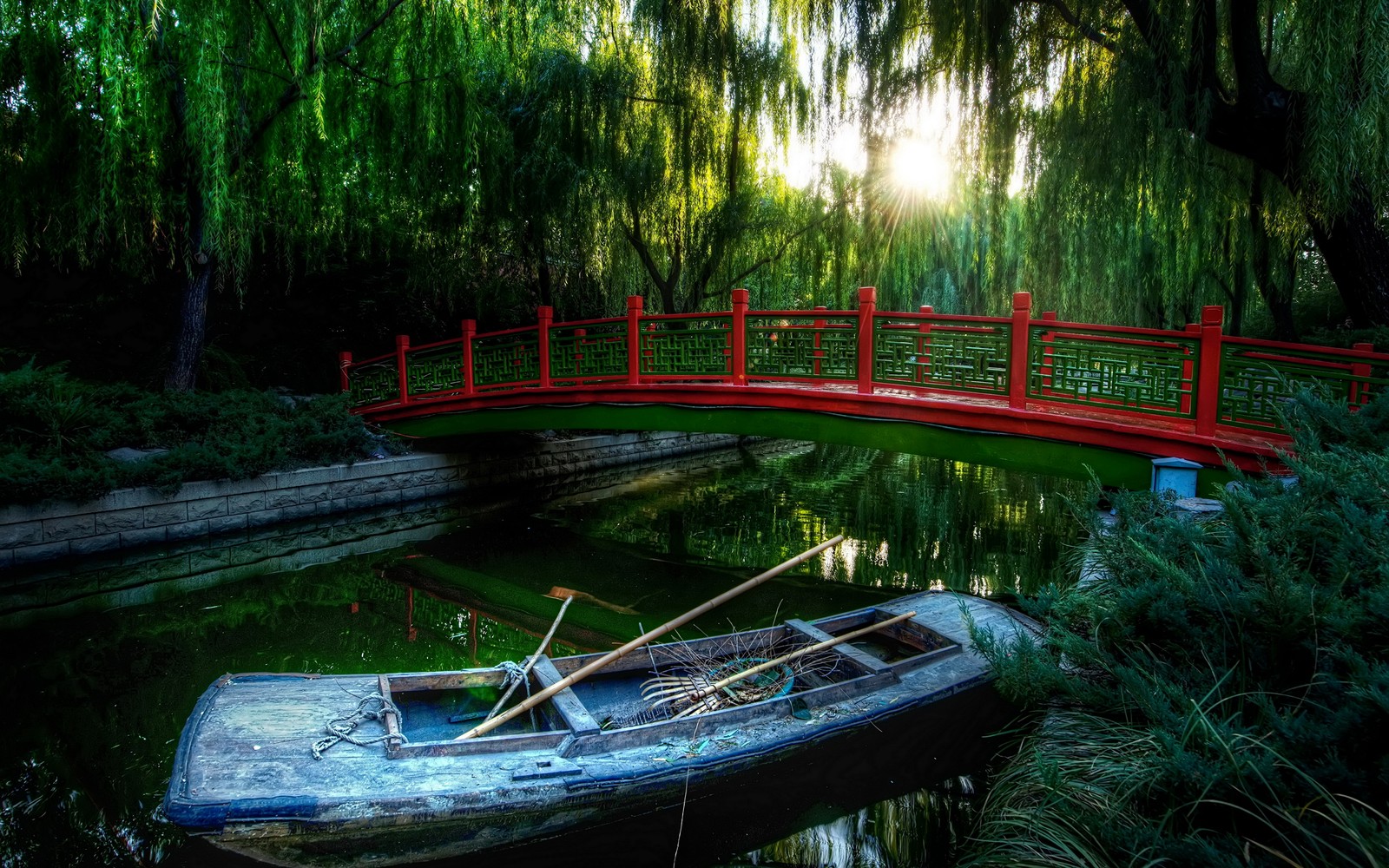 Arafed boat on the water with a red bridge in the background (nature, water, green, vegetation, nature reserve)