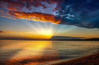 Serene Sunset Over Tranquil Ocean Horizon