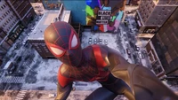 Miles Morales as Spider-Man perched on a city rooftop, showcasing a vibrant street mural that reads "Black Lives Matter.