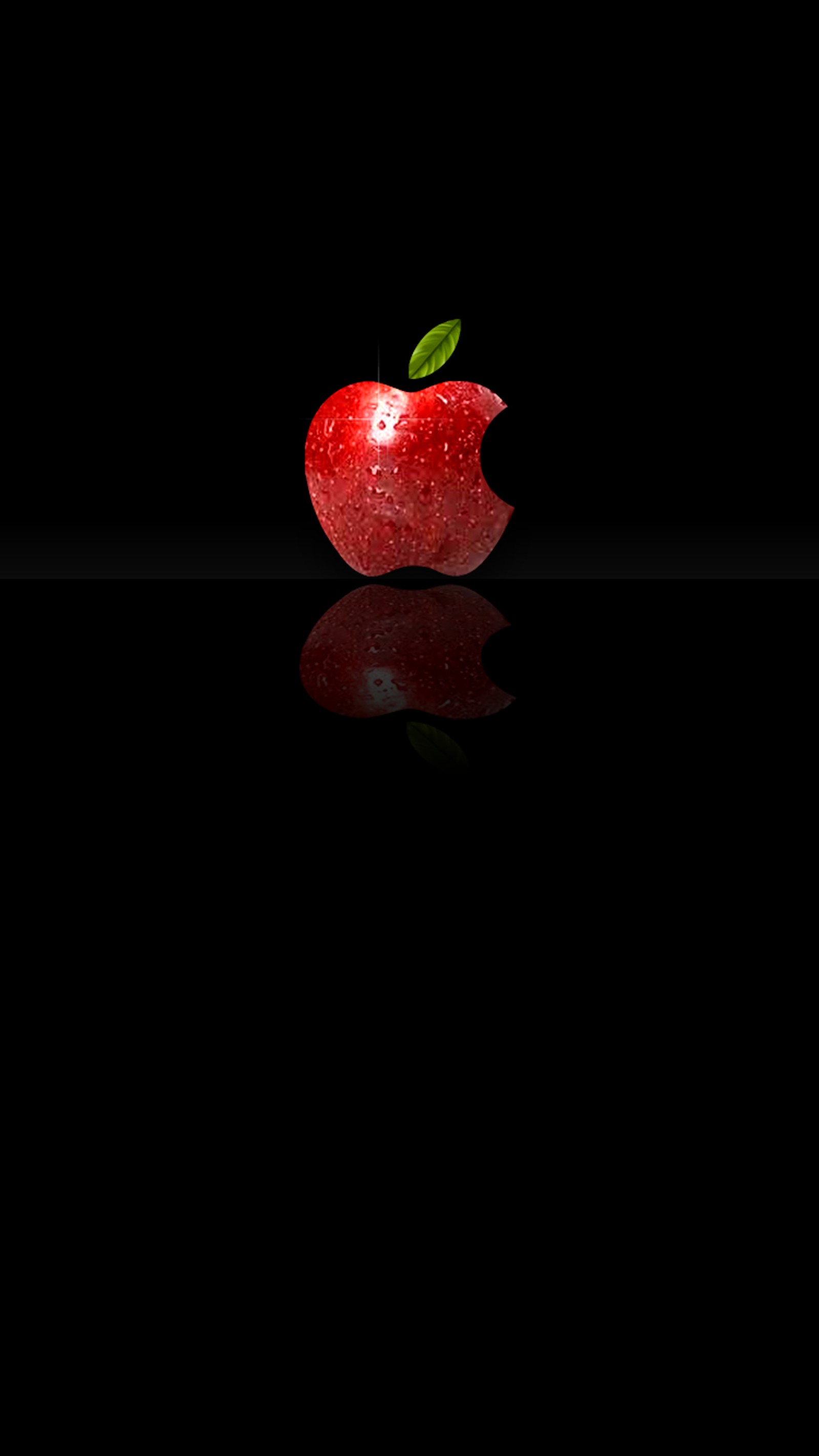 There is a red apple with a leaf on it on a black surface (2017, apple, logo)