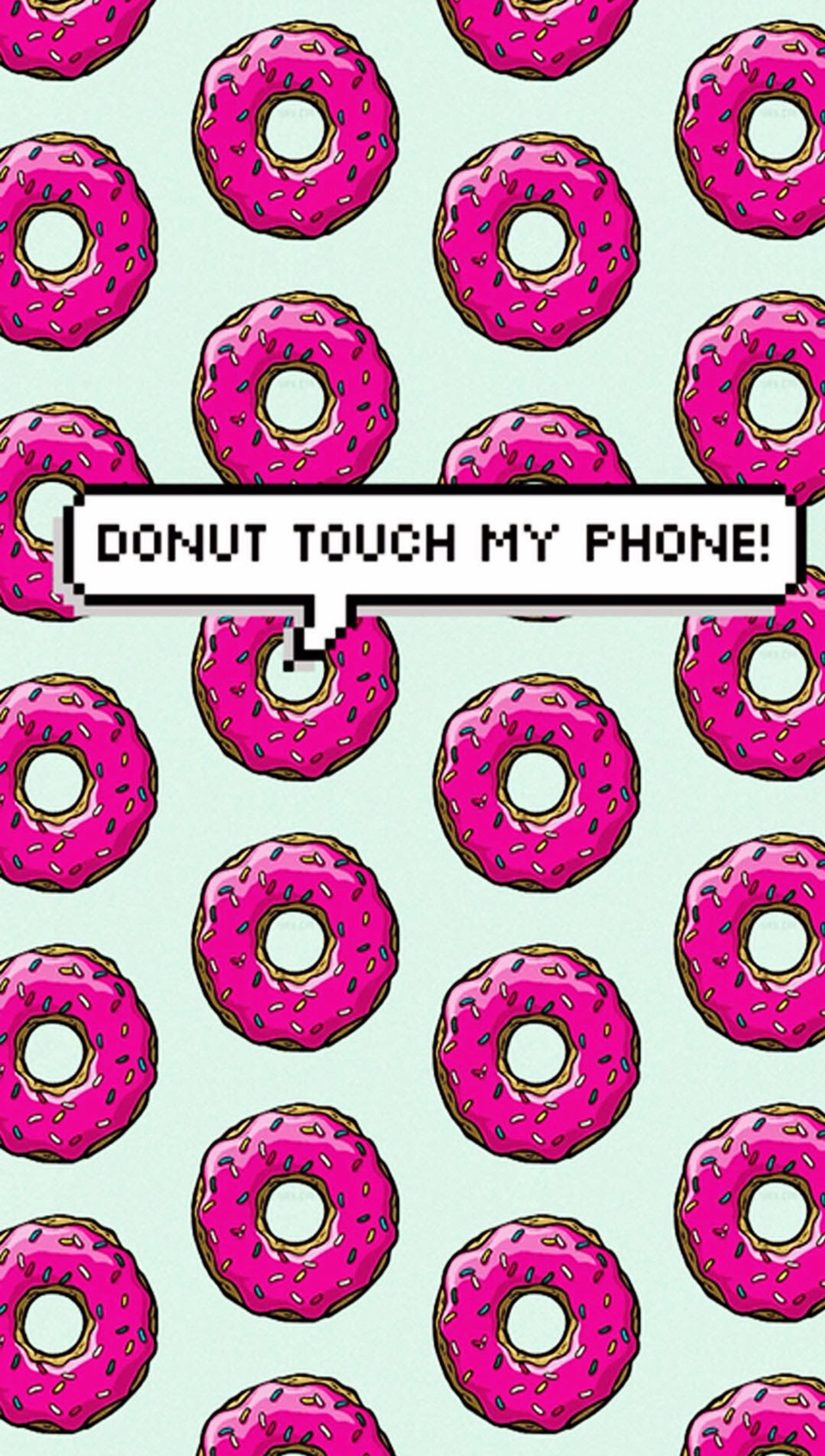 A close up of a donut with a sign on it (donut, funny, phone)