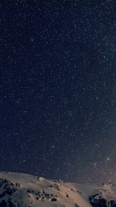 Starry Arctic Night Over Snow-Covered Mountains