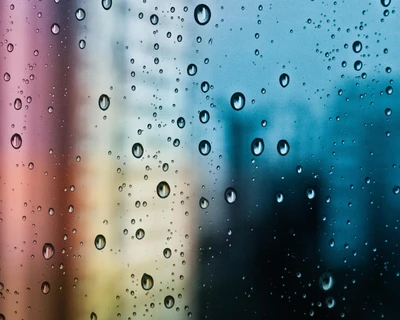 Colorful Reflections Through Raindrops on Glass