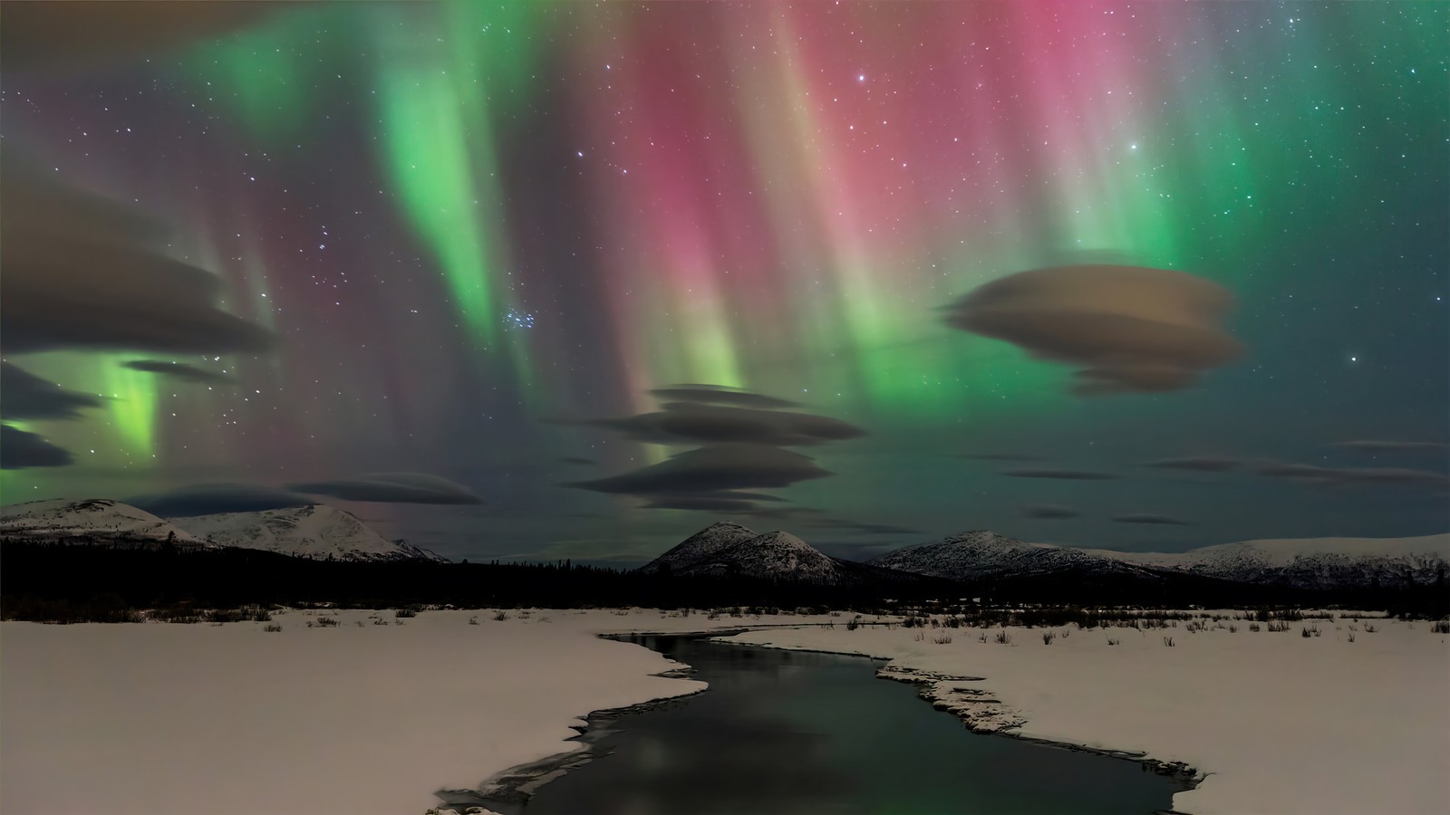 A view of a stream of water with a mountain in the background (aurora borealis, northern lights, night, sky, scenery)