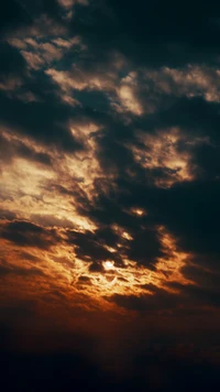 Amber Afterglow: Cumulus Clouds at Dusk