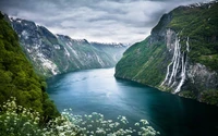 Majestic Geiranger Fjord Surrounded by Lush Mountains and Cascading Waterfalls