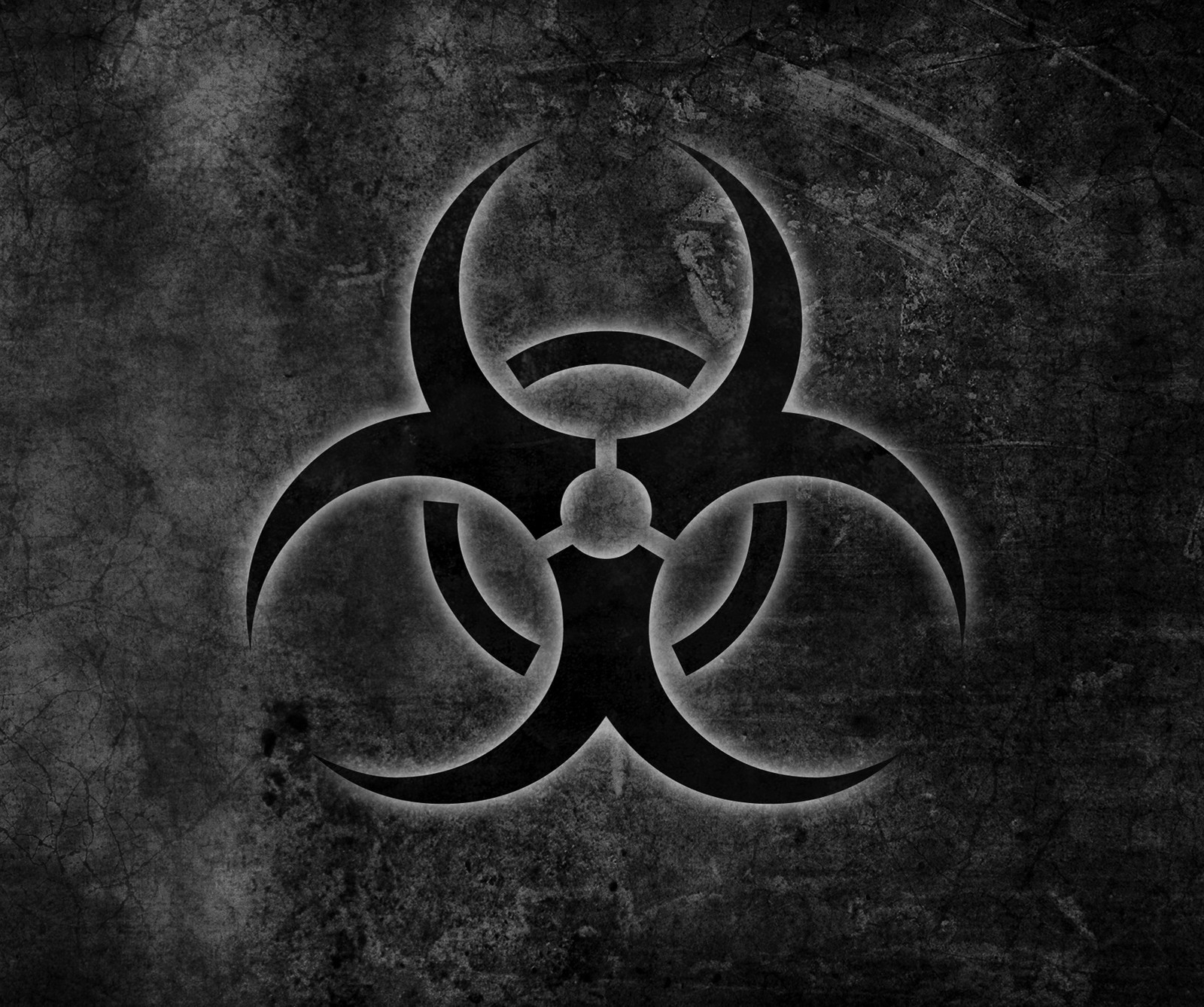 A black and white photo of a biohazard symbol on a concrete wall (biohazard, symbol)