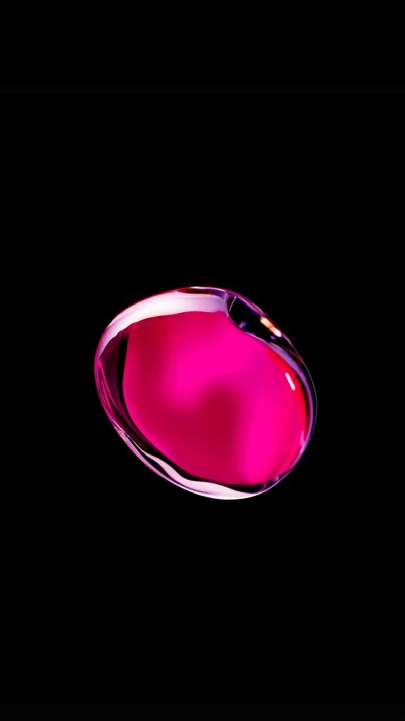 Un primer plano de una gota de líquido rosa sobre un fondo negro (5s, 6s, manzana, hd, ios)