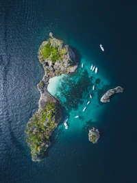 Serene Aerial View of a Tropical Atoll Surrounded by Crystal Clear Waters